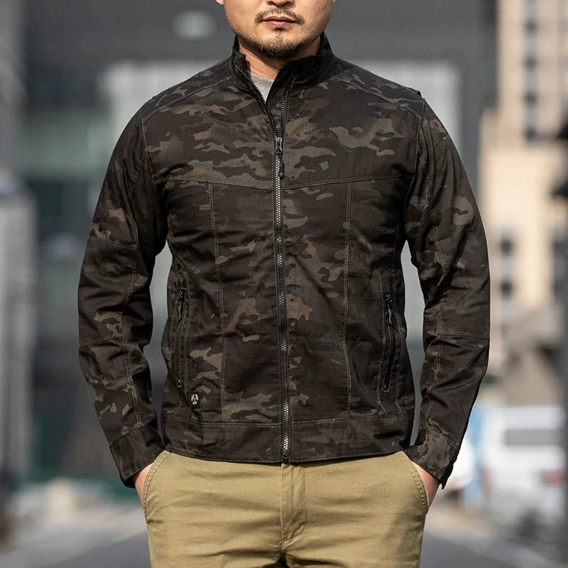 Man wearing a brown plaid pattern Outdoor Tactics Coat Assassin Jacket with a wear-resistant polyester shell.