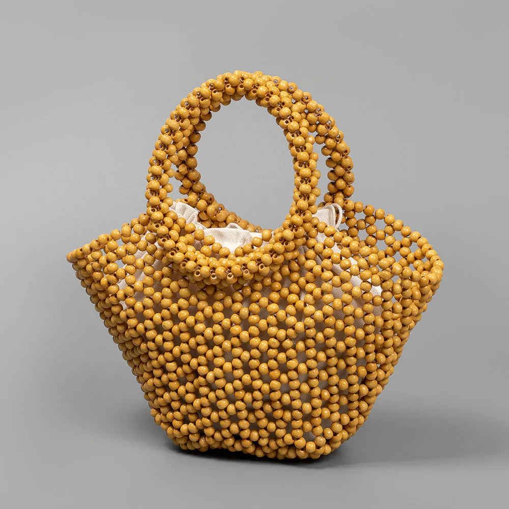 Hand-woven maple hollow handbag with wooden bead decoration, dumpling-shaped 13x7x18cm beach bag