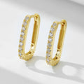 A pair of oval geometric sterling silver ear clips with zircon stones in white or yellow colour.