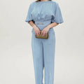 Blue polyester men's suit with long-sleeve jacket and trousers on a hanger.