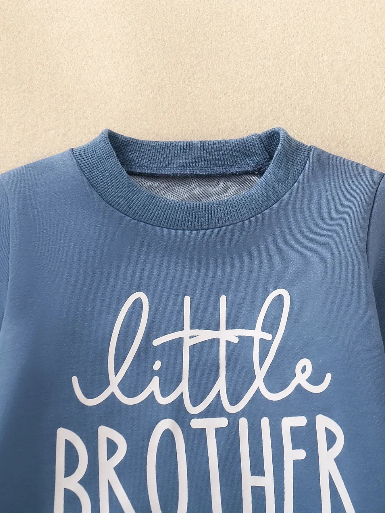 Boys and girls cotton letter long sleeve sweater suit in navy blue with matching pants set on white background.