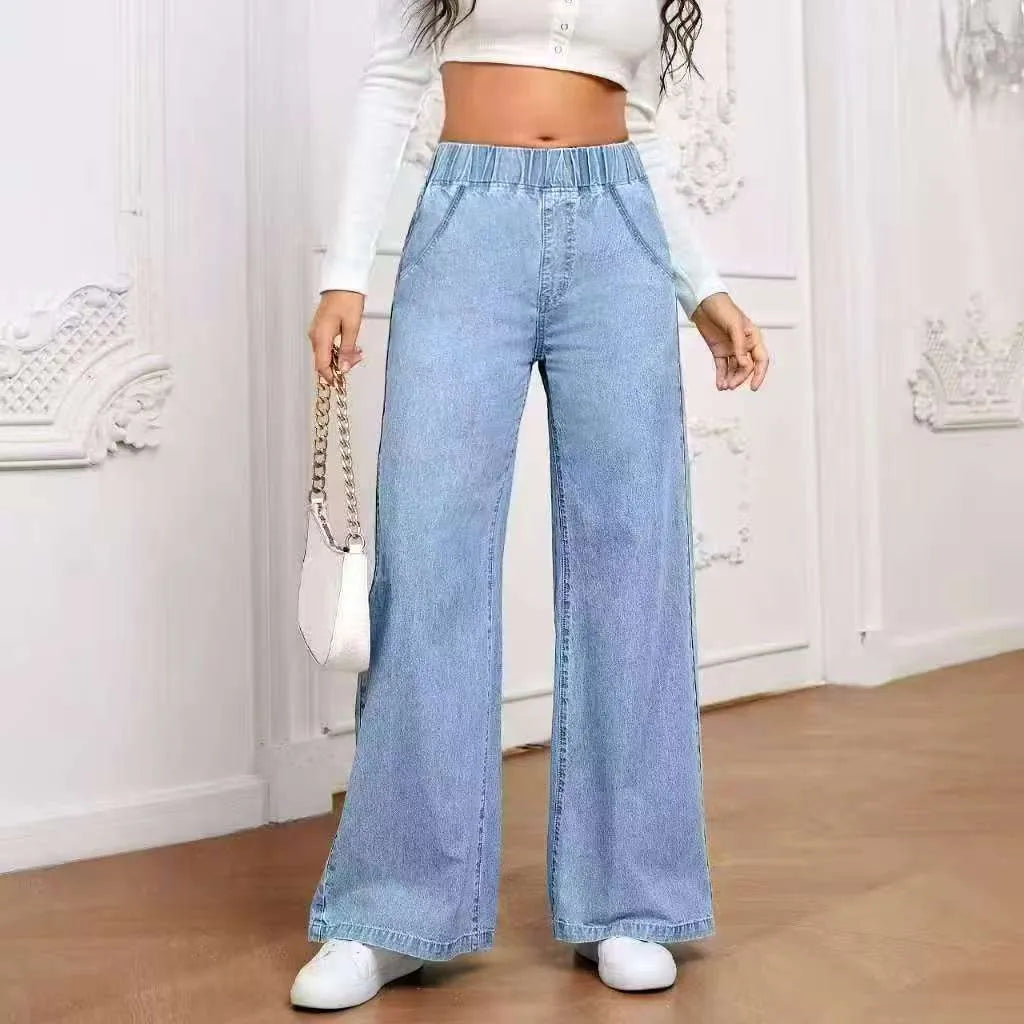 Plus size light blue washed denim trousers with a wide-leg straight cut and zip fly.