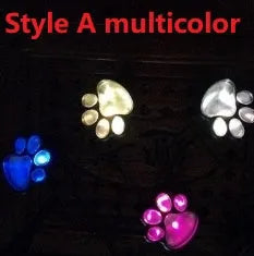 Set of four black bear paw-shaped solar garden lights with solar panel pole
