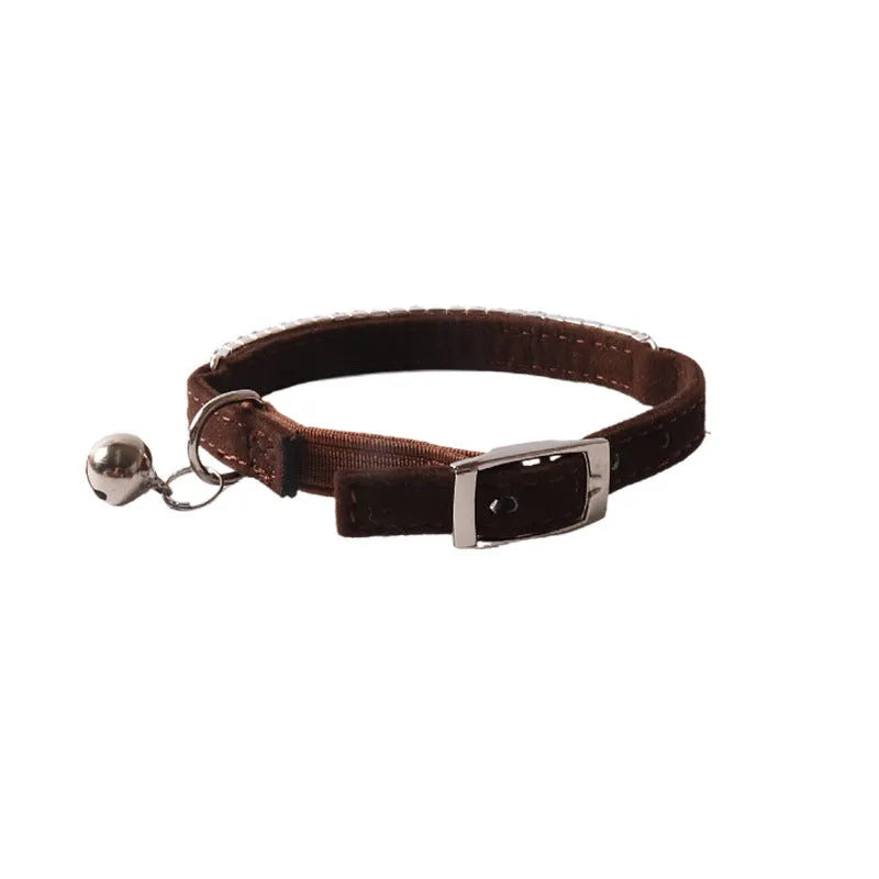 Soft pink flocked adjustable cat collar with elastic buckle on a 28cm length.