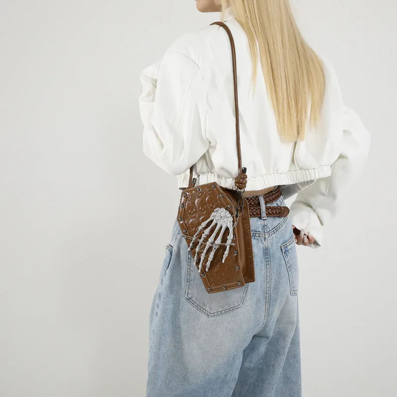 Square vertical one-shoulder handbag with single strap, embossed detail, and phone pocket