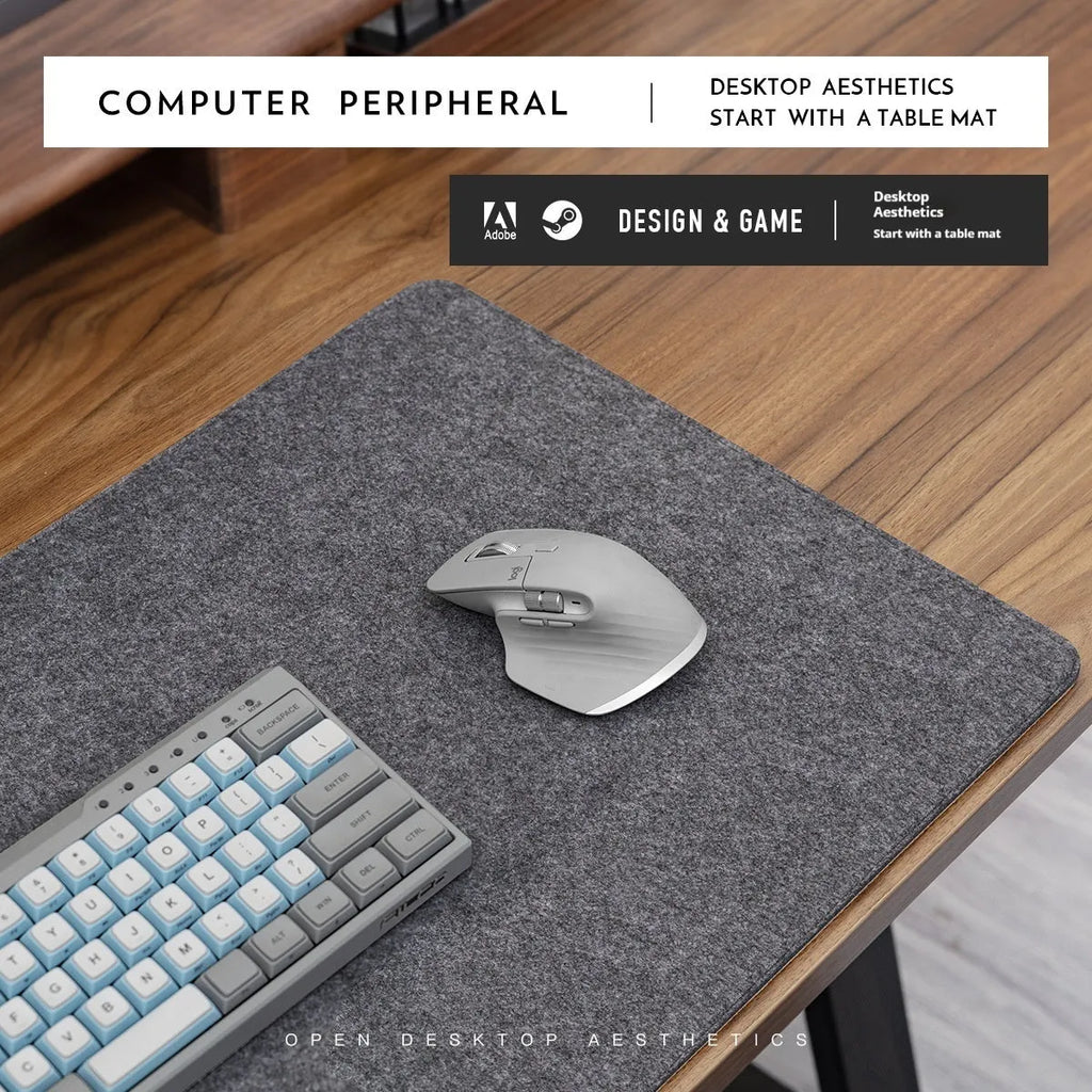 Oversized grey felt and cork office mouse mat on a wooden desk