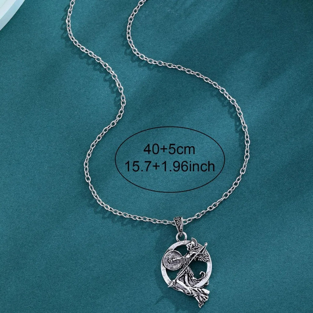 War Goddess Accessories gold-tone retro fashion necklace with warrior goddess pendant on a woman