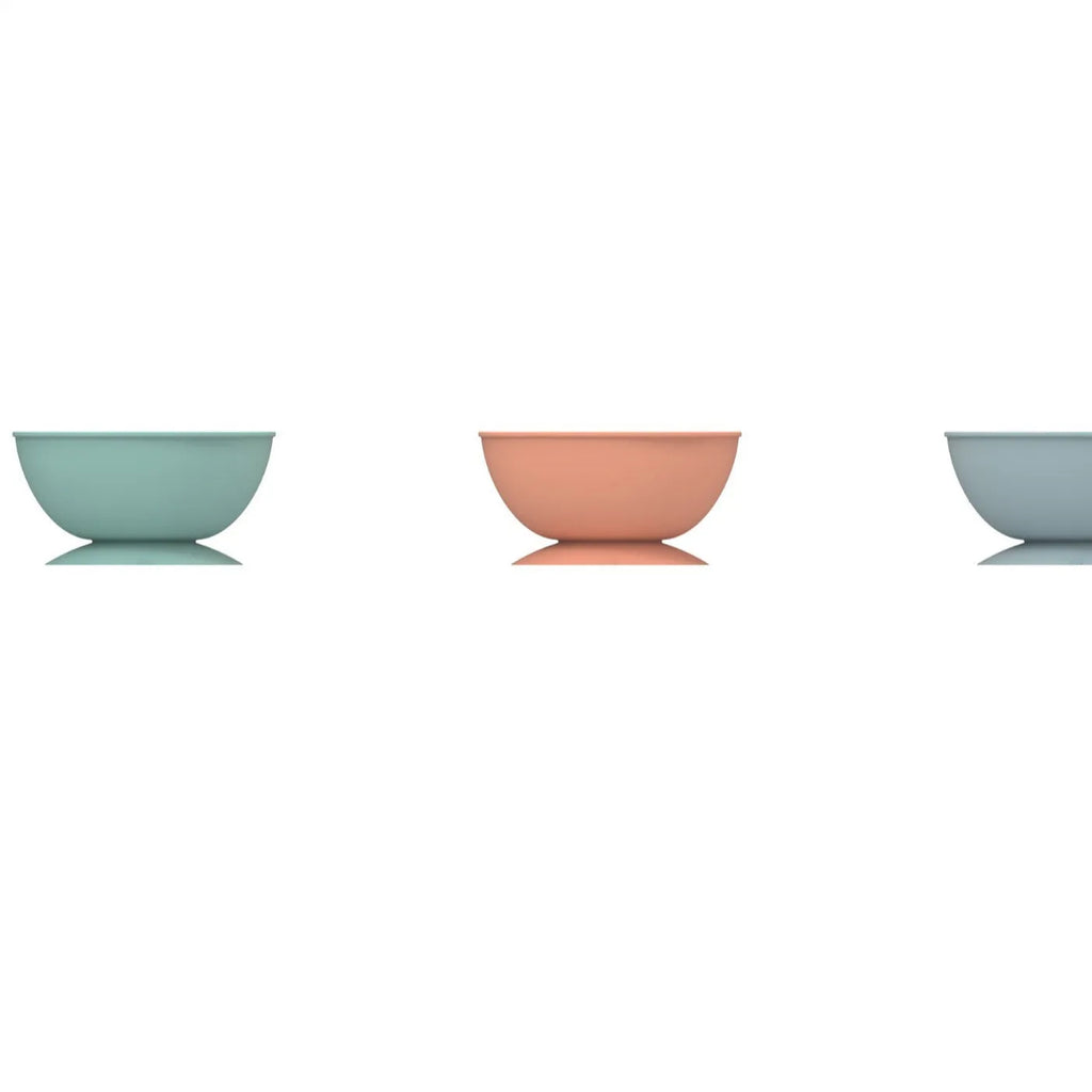 Cyan silicone pet bowl with textured licking mat pattern and suction cup base