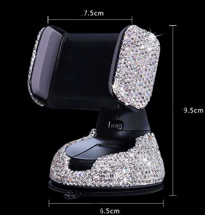 Diamond-encrusted car phone holder mounted on air vent with adjustable push-button mechanism and smartphone securely held