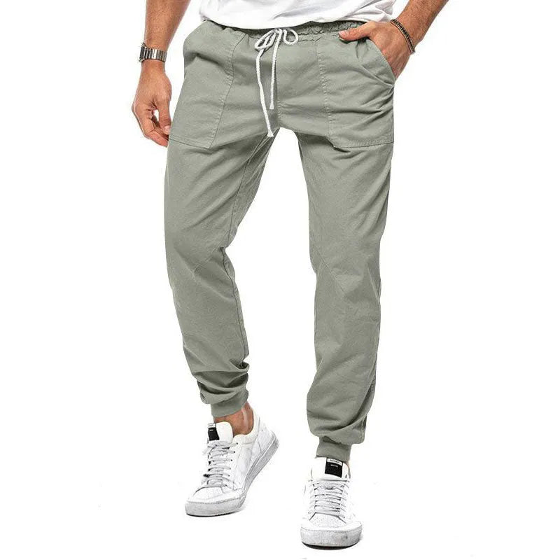 Men's loose tapered casual trousers with drawstring waist and ankle bands in solid colour