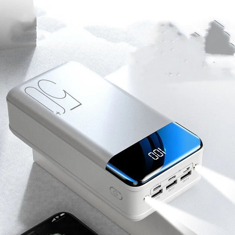 Black large capacity 50000mAh power bank with multiple USB ports on a white background