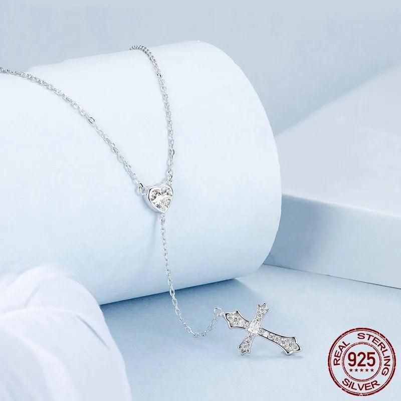 Simple silver cross necklace with V-neck and O-ring chain in colour BSN384.