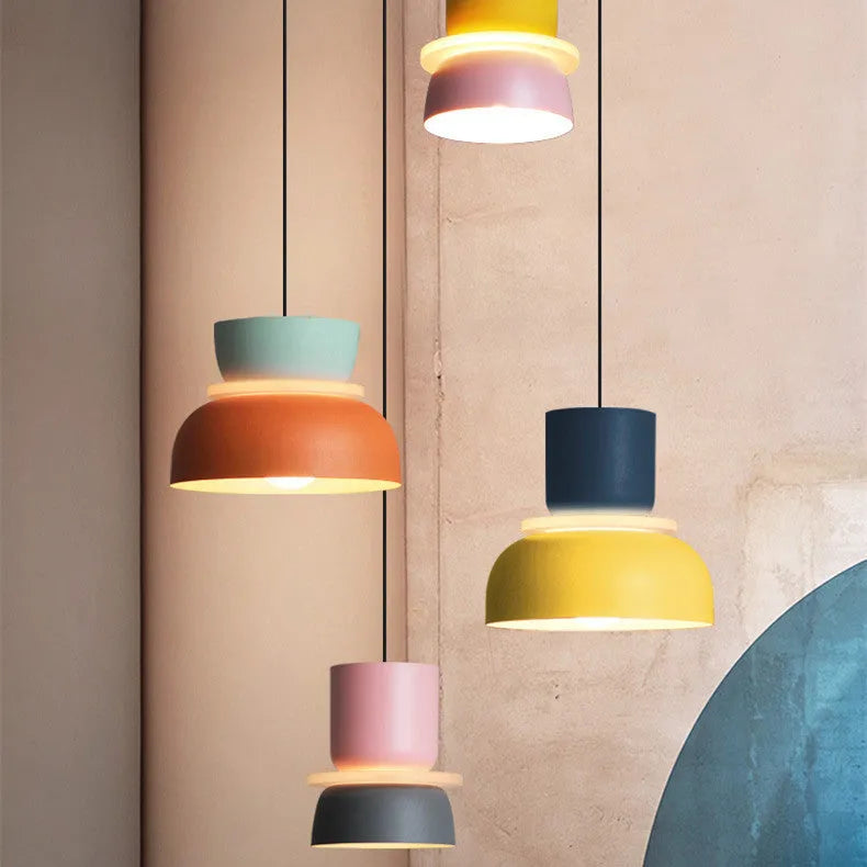 Nordic minimalist iron pendant light in a dark colour with a warm light bulb for bedroom or cafe use