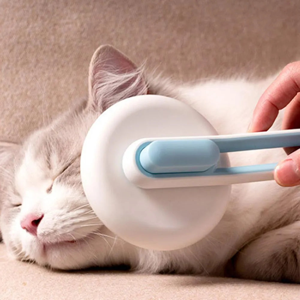 Blue automatic pet grooming comb with round brush head and ergonomic handle