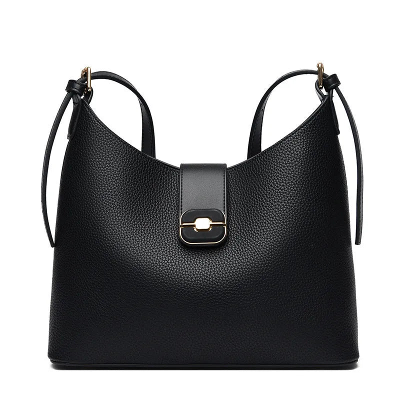 Black PU bucket bag with a single shoulder strap, showing contrast stitching and a lock detail.
