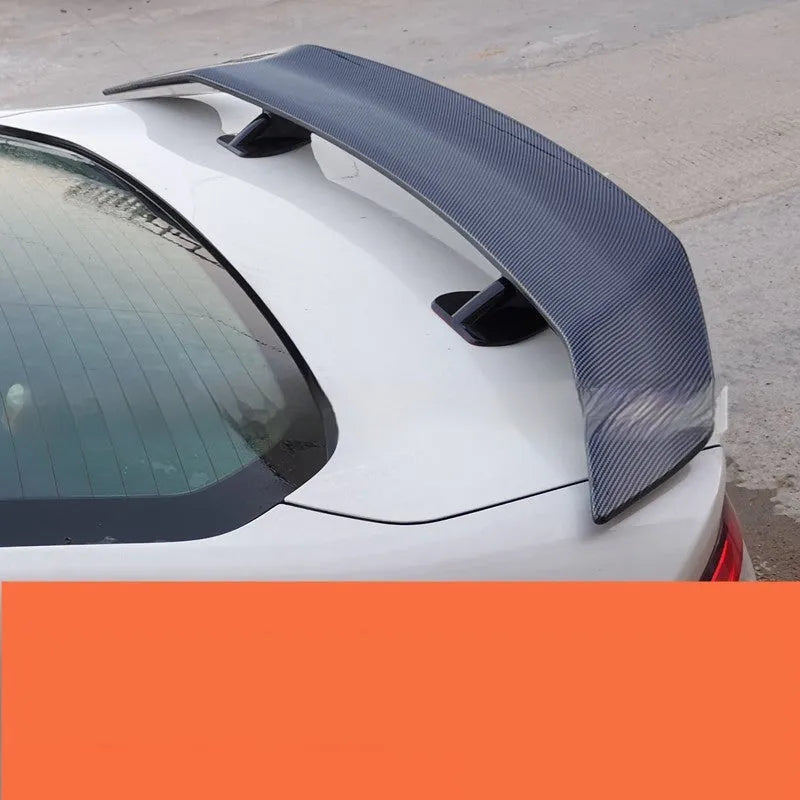 Universal punch-free ABS plastic car spoiler tail wing in black, white, carbon pattern, or blank finish.