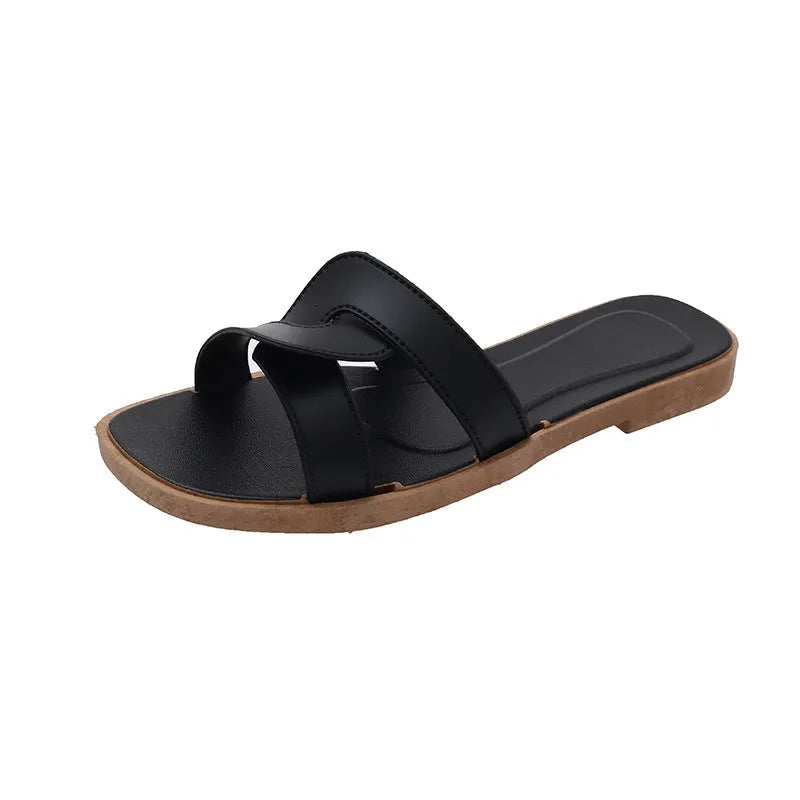 Women's PVC cross-strap flip flop sandals in light blue on a plain background.