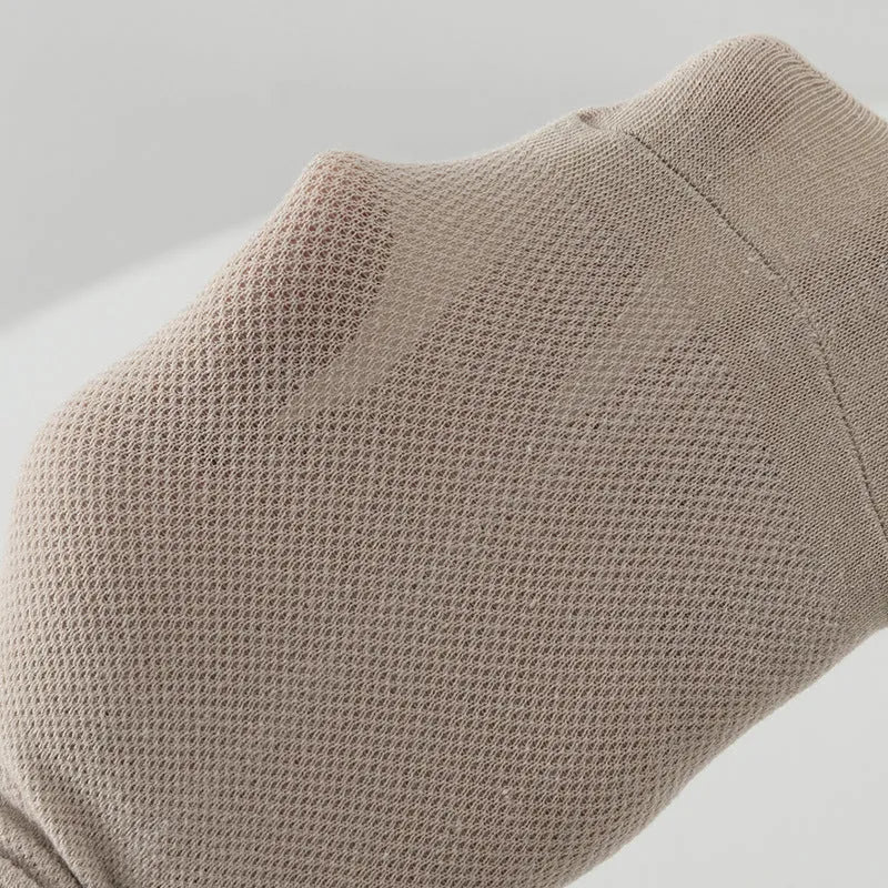 Men's solid colour low-cut polyester boat socks in assorted hues on a white background.