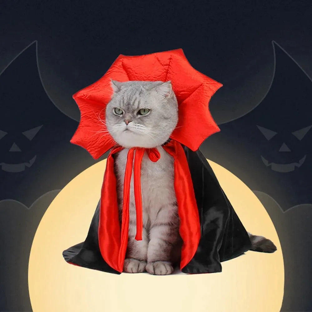 Small black pet vampire cloak costume for dog or cat on hanger with S M L size tags.