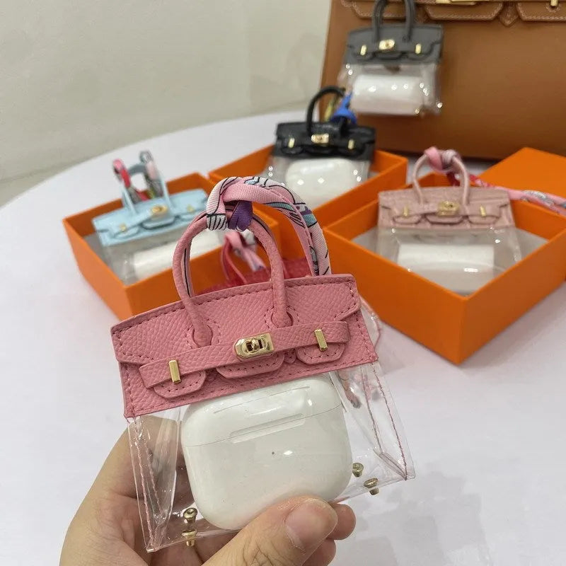 Women's artificial leather car key case showing examples of palm print and crocodile pattern designs.