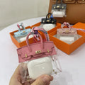 Women's artificial leather car key case showing examples of palm print and crocodile pattern designs.