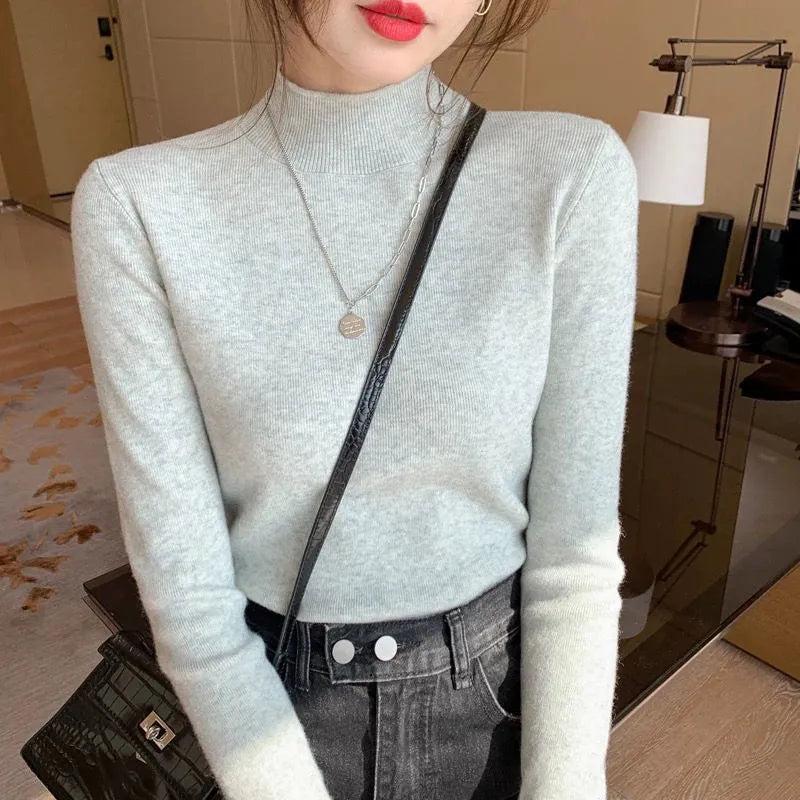 Women's slim fit knitted long sleeve shirt in viscose, shown in apricot colour.