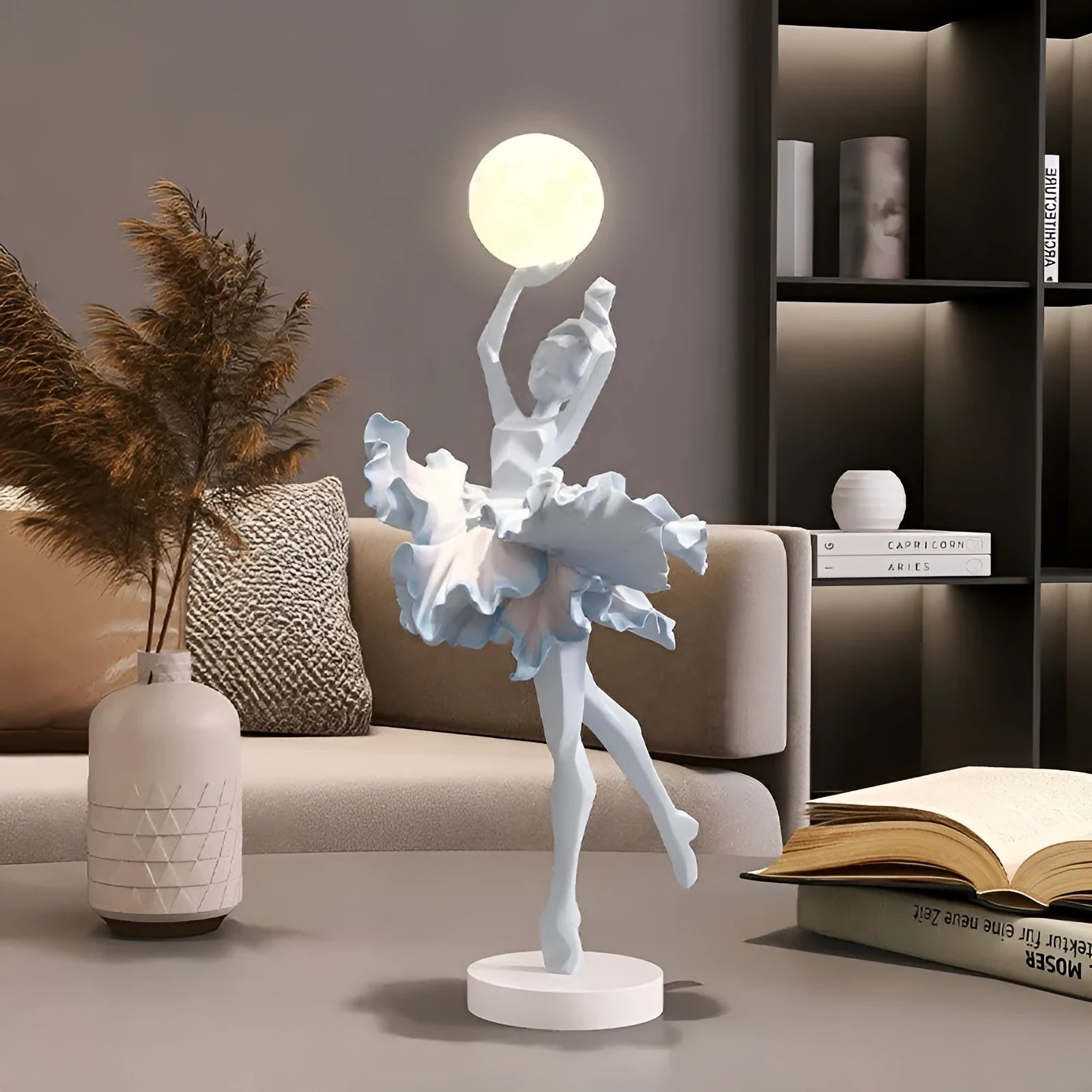 Small modern resin night light ornament with USB charging cable in black gold colour.