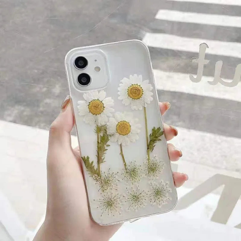 White epoxy daisy floral design TPU phone case for iPhone, showing back cover.