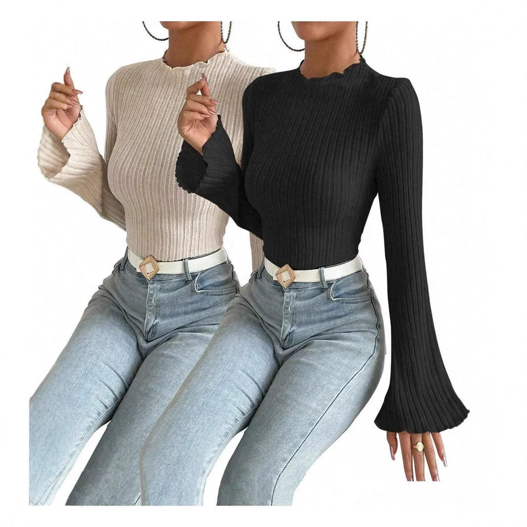 Long sleeve casual top in black with lantern sleeves and a sunken stripe pattern, laid flat.