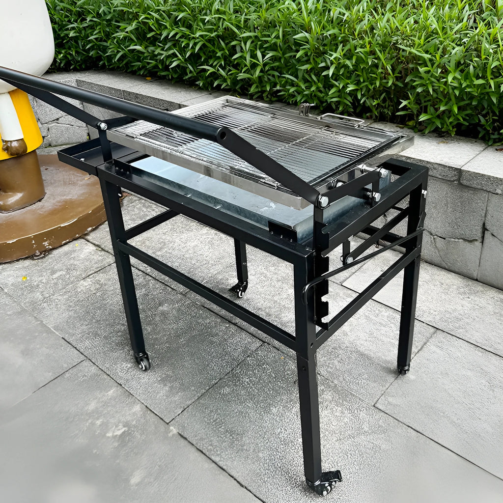 Large foldable charcoal BBQ stove set up in a garden.