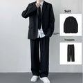Men's plus size three-piece college style suit set featuring a grey jacket, trousers, white shirt, and striped tie.