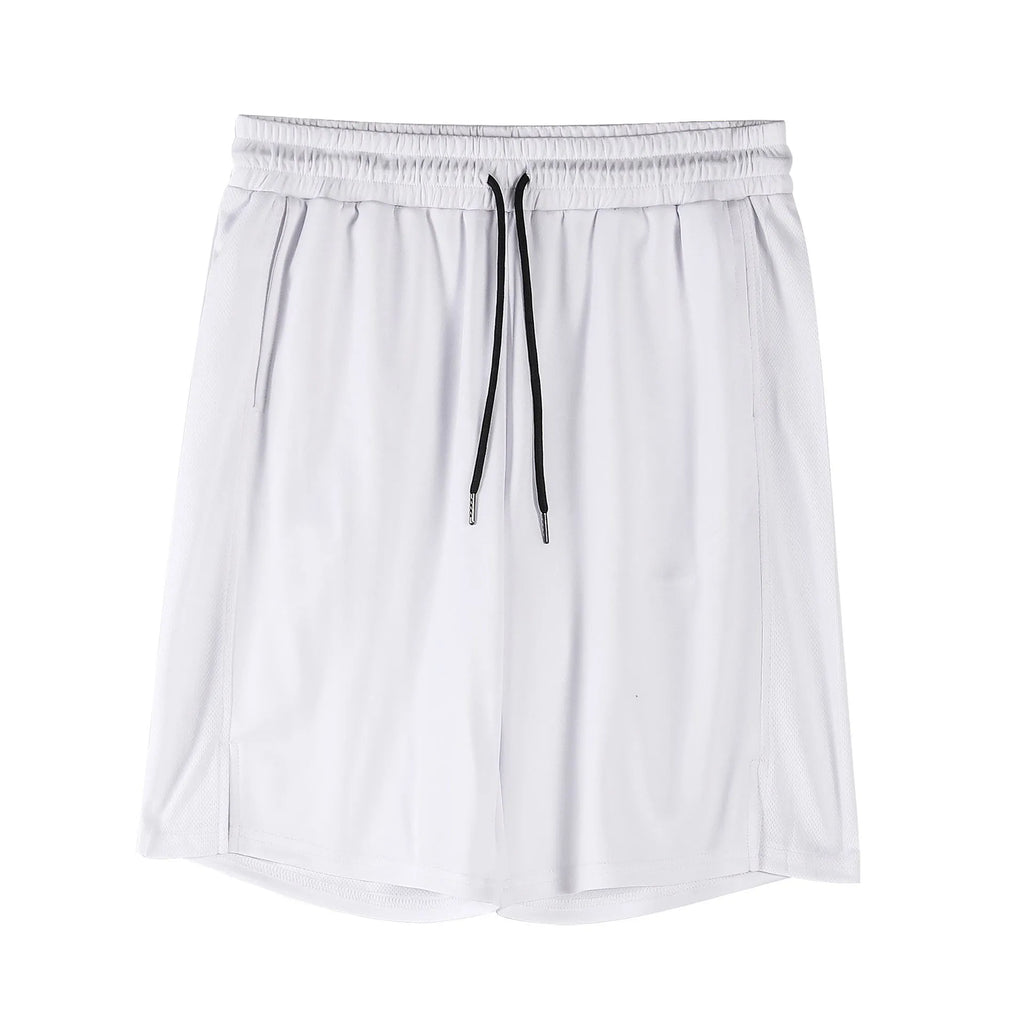 Man wearing black loose-fit quick-dry mesh capri shorts for casual summer fitness.