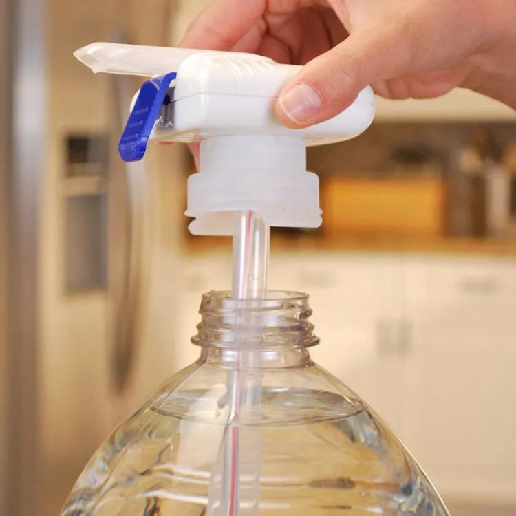 Electric beverage pump with blue press handle and a long white straw next to its colour box packaging.
