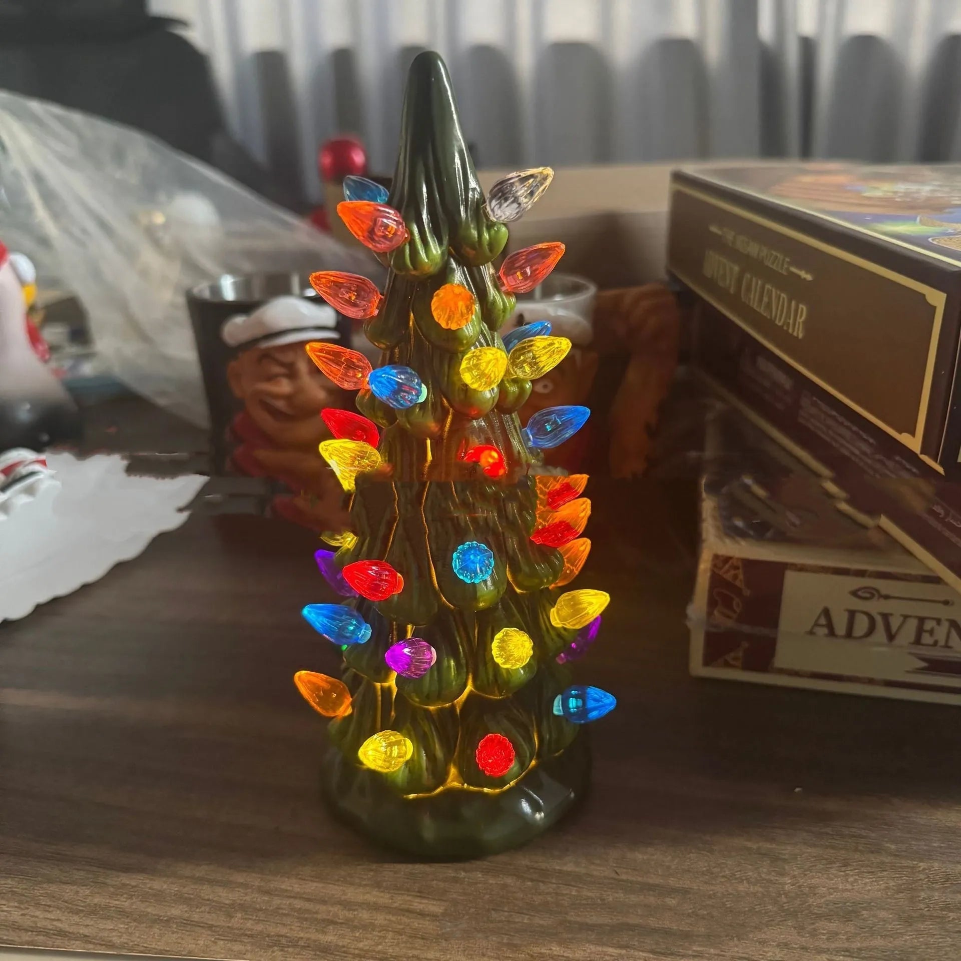 A resin Christmas tree light decoration in European style, showing coloured light option.