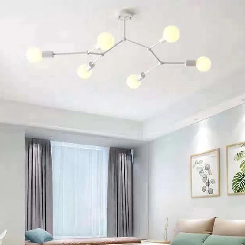 Minimalist black iron ceiling chandelier with six light heads in a Nordic style, against a white background.