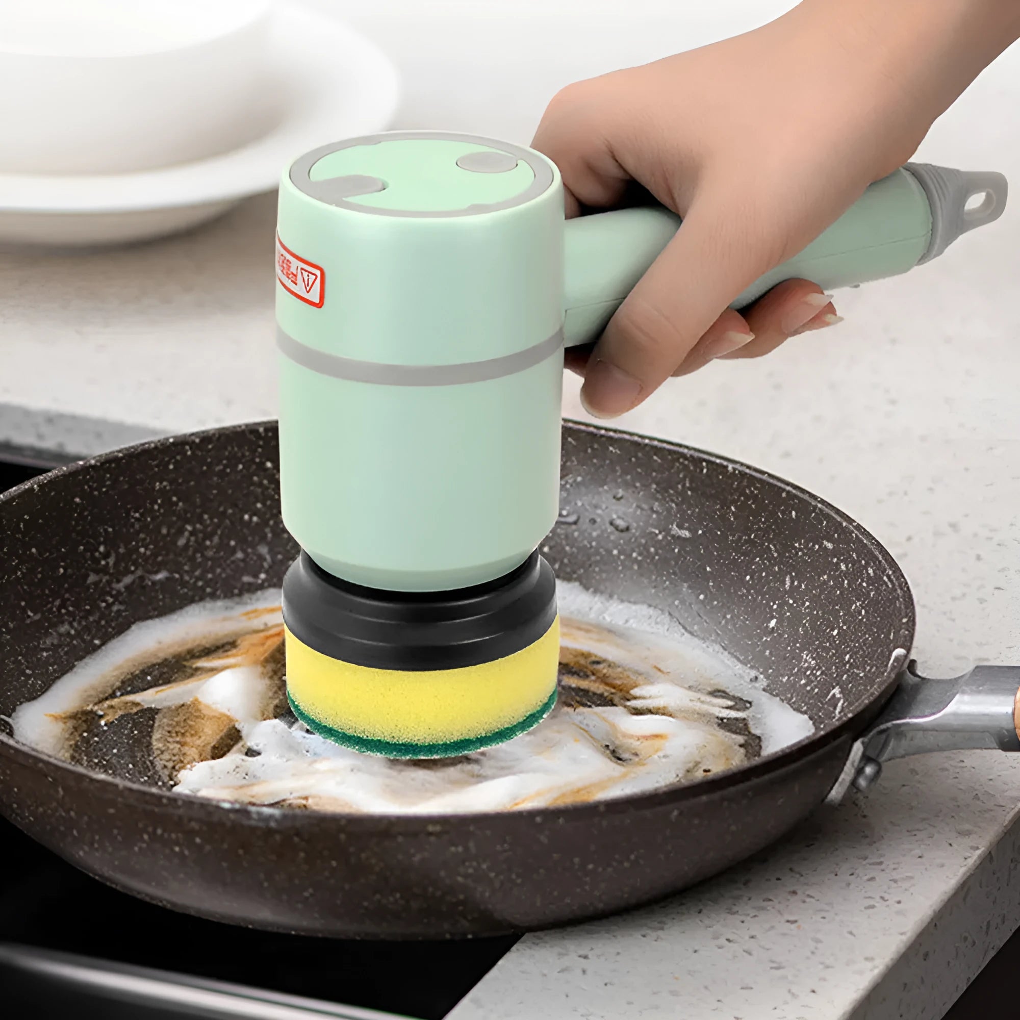 White electric cleaning brush with rotating scrub head and separate scouring pad attachment