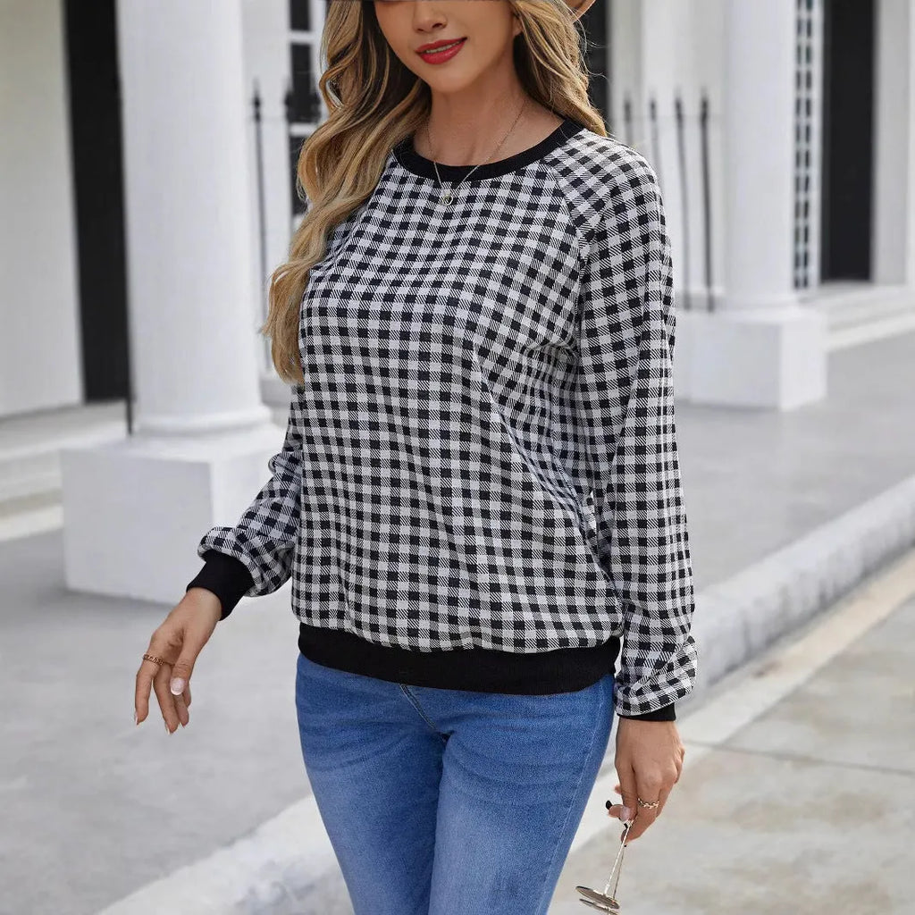 Black plaid stripe long sleeve pullover sweater laid flat, showing Japanese style pattern.