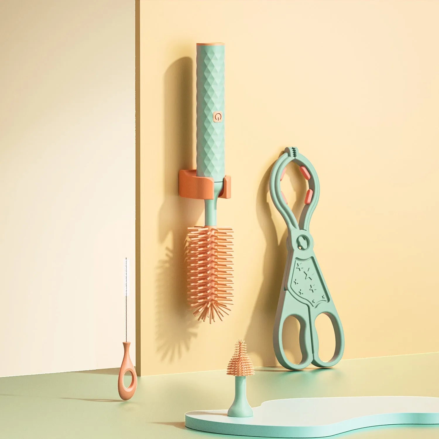 Pink and green electric rotating bottle cleaning brush with silicone bristles on a white background.