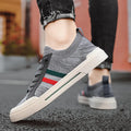 Men's low-top casual sneakers in breathable knitted mesh with an elastic band and rubber sole.
