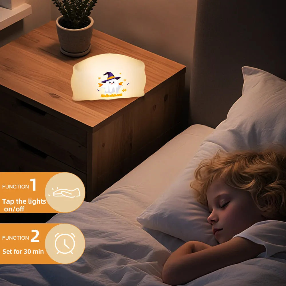 Cartoon Halloween doll table lamp in Magic Ghost colour with warm LED glow, shown on a bedside table.