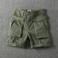 Men's straight-leg cargo shorts in army green with multiple pockets, made from stretch cotton fabric.