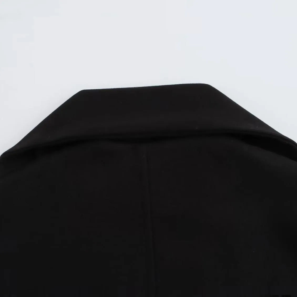 Women's longline polyester coat with an artificial fur collar in a street fashion style.