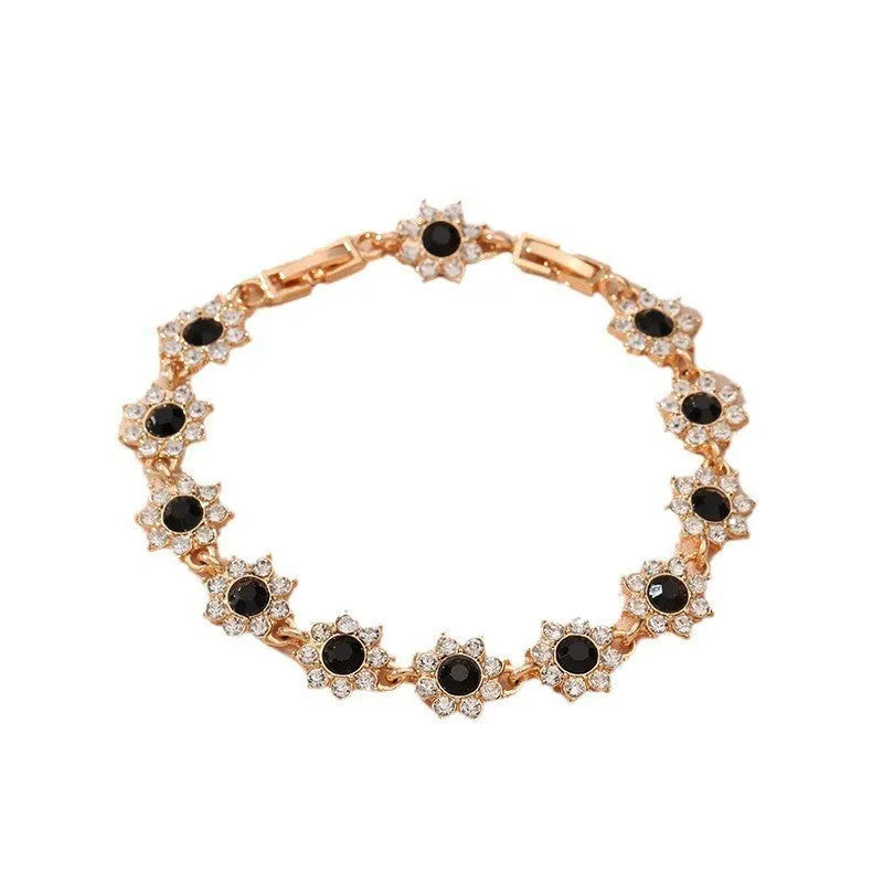 Electroplated zinc alloy flower bracelet with colourful crystal and diamond stones in gold and silver colour finishes