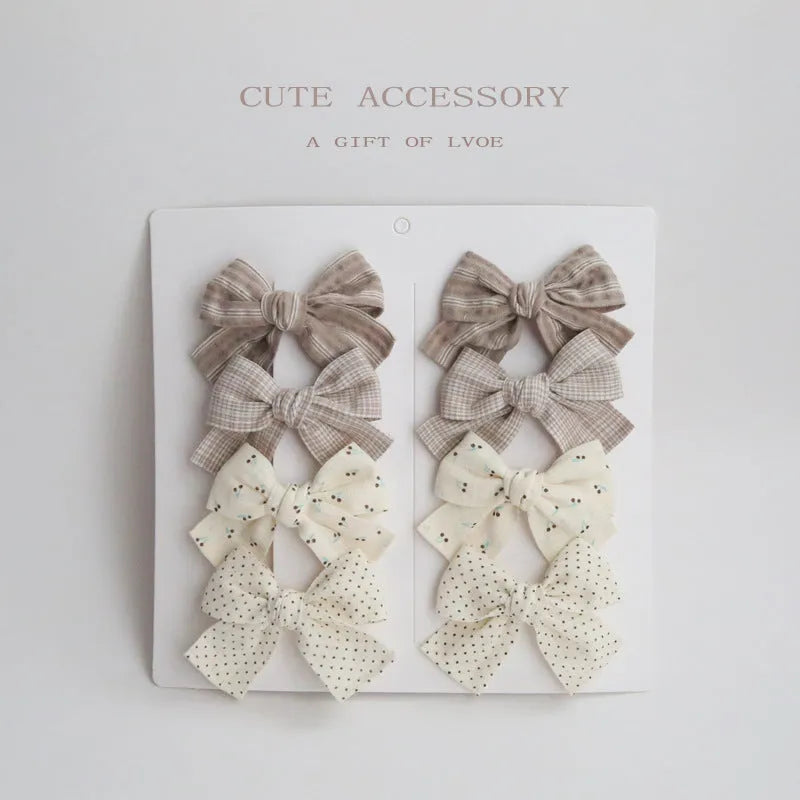 Dovetail bow hairclip set for children in cloth material with eight colour options