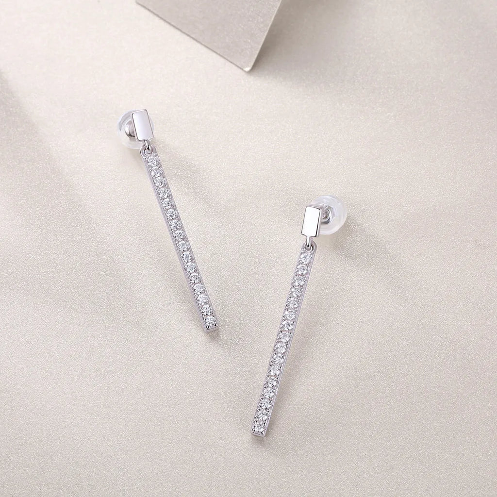 Pair of moissanite stud earrings in S925 silver with platinum plating on white background
