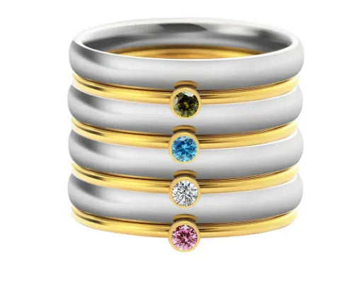 Engraved December birthstone ring in titanium steel with geometric shape on a grey background.