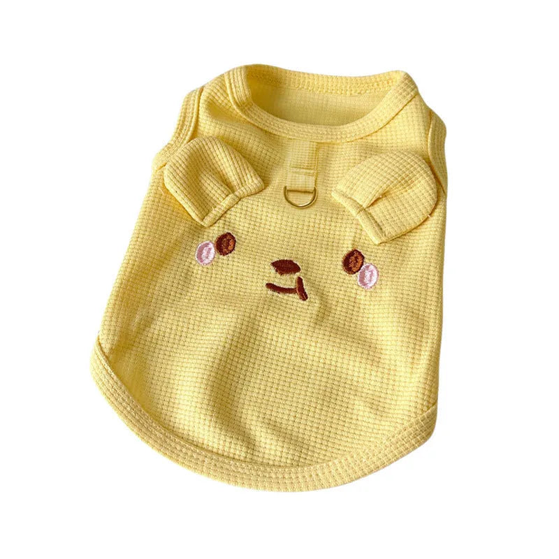 Yellow waffle fabric dog vest on a small dog, showing casual style and fit.