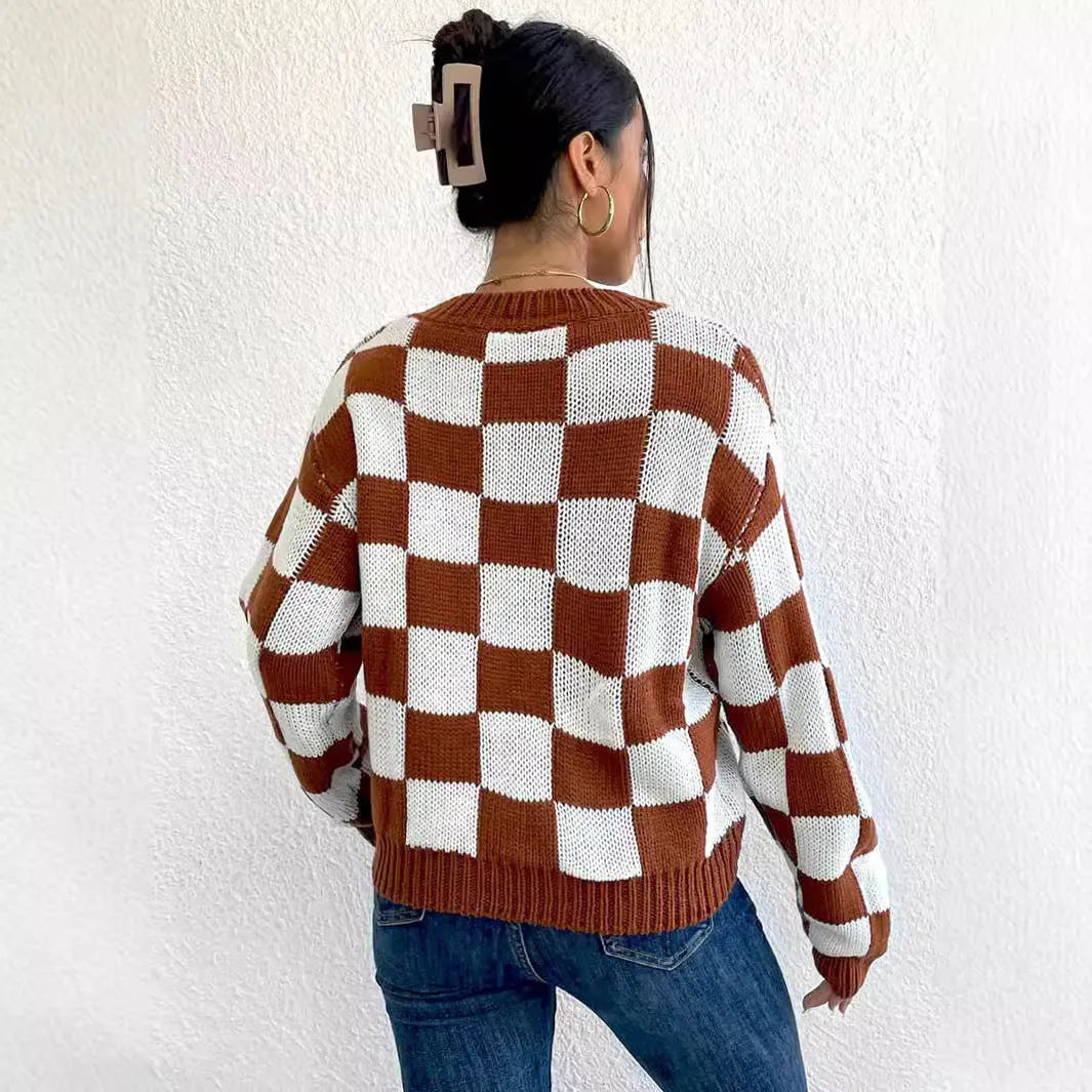 Dark brown plaid pattern acrylic pullover sweater with long sleeves and a loose round neck.