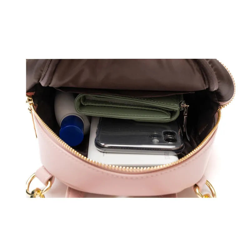 Soft PU mini backpack in street style, shown open to reveal internal phone pocket and zipper bag.
