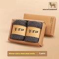 Pair of thick, solid-colour men's winter wool socks showing reinforced heel and midsole cushioning.